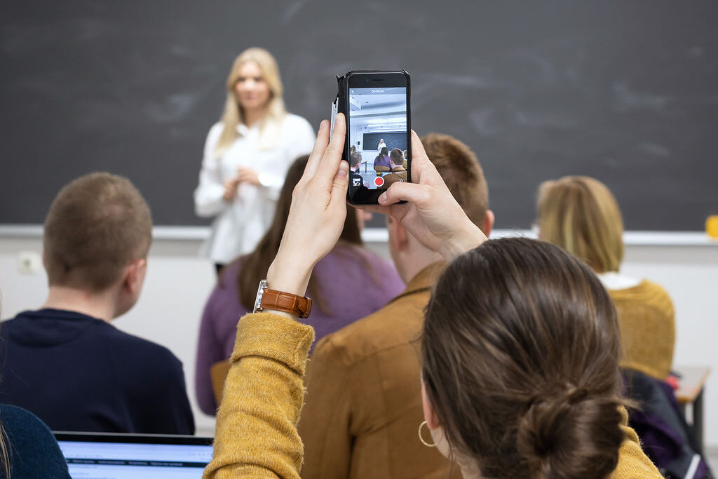 Student records video in the classroom